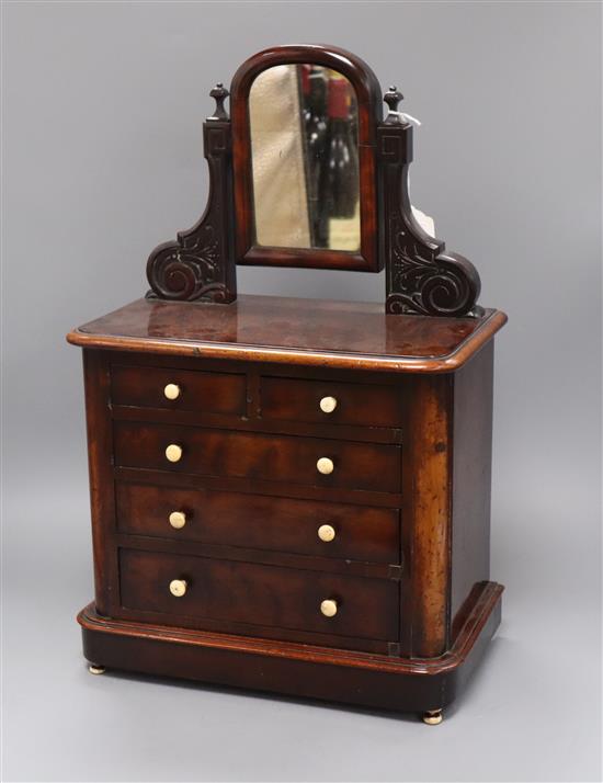 A miniature rosewood chest, with ivory handles and feet, c.1850 (dedication under drawer) height 50cm